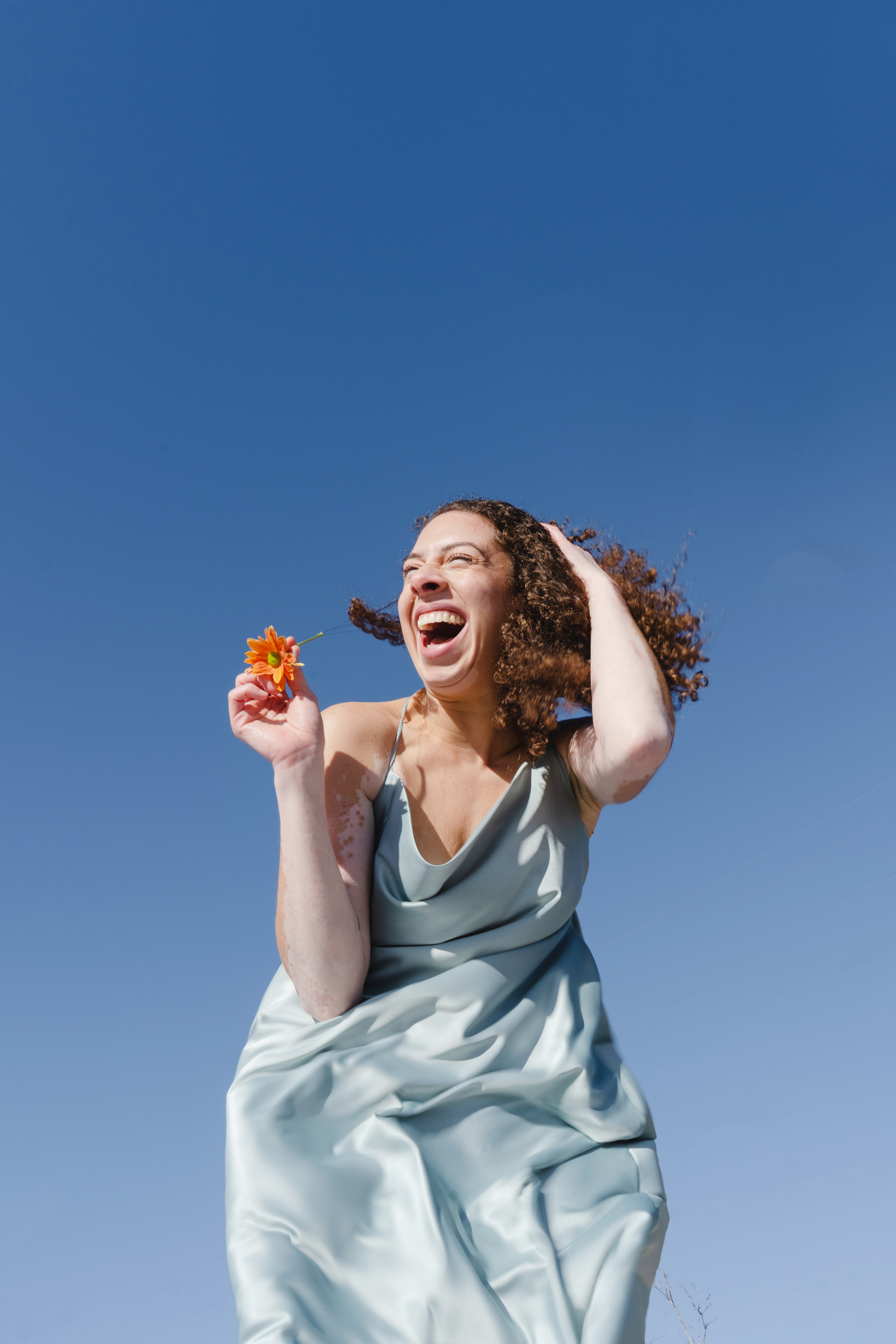 Woman in Silk Flowy Dress on a Clear Day